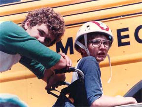 children next to a bus